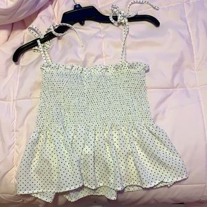 white and black polk dot top.